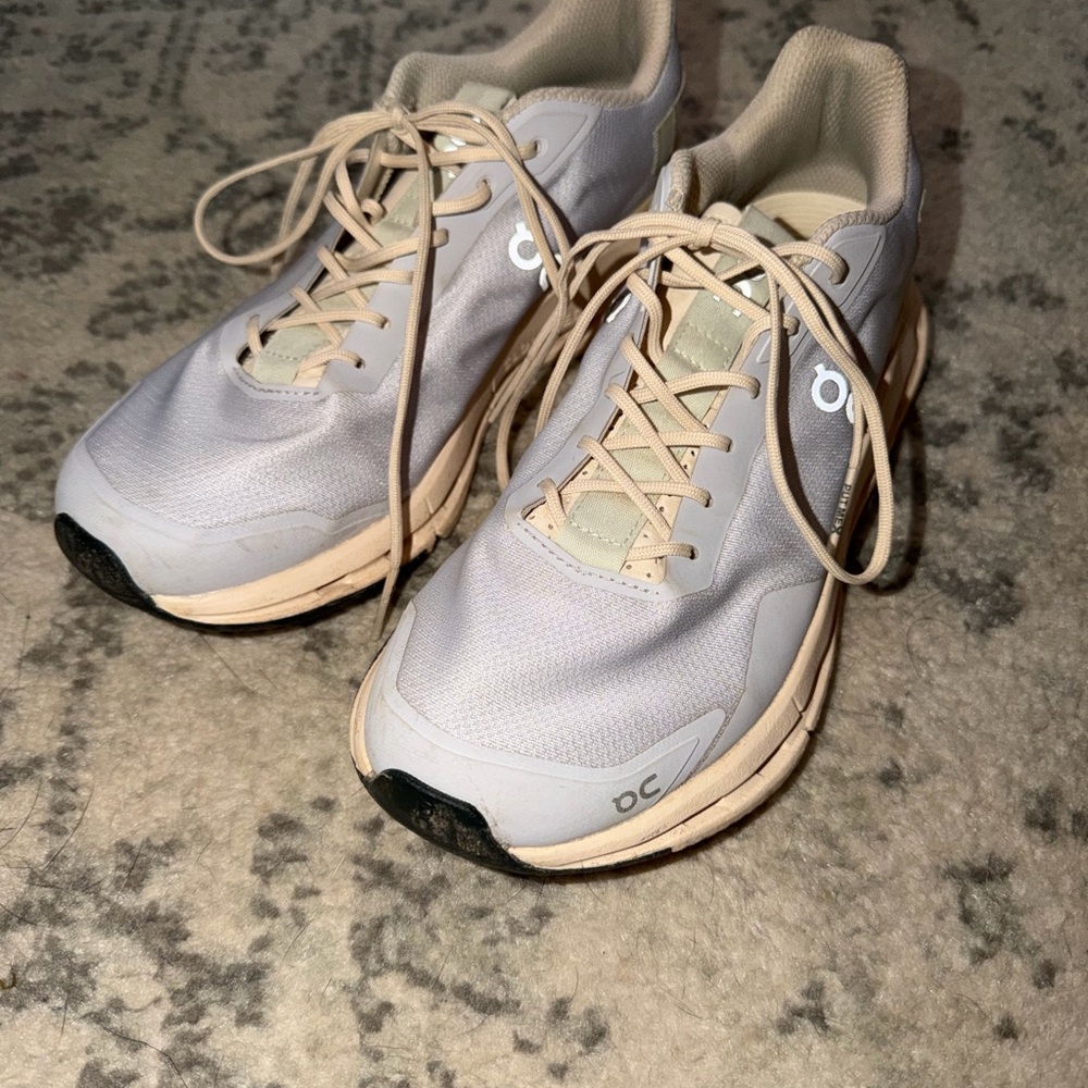 On Running Cream and Tan Athletic Shoes